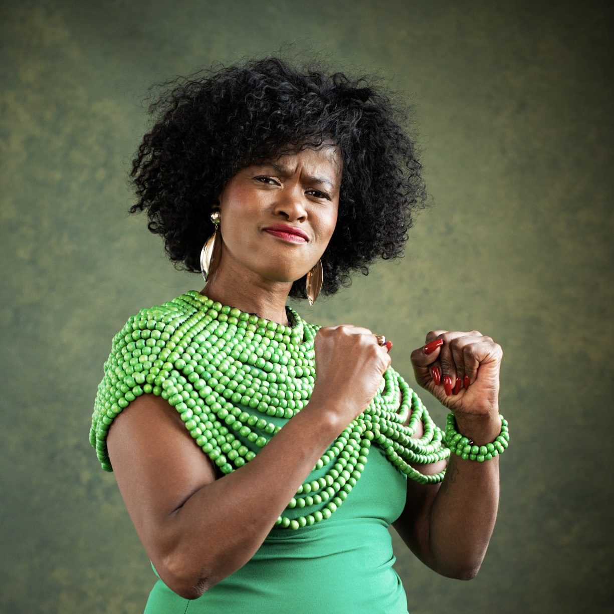 Tae Betty in a gesture of concentrated strength
