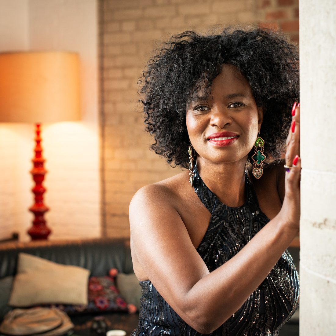 Tae Betty in a modern setting in Europe, in a dark evening dress