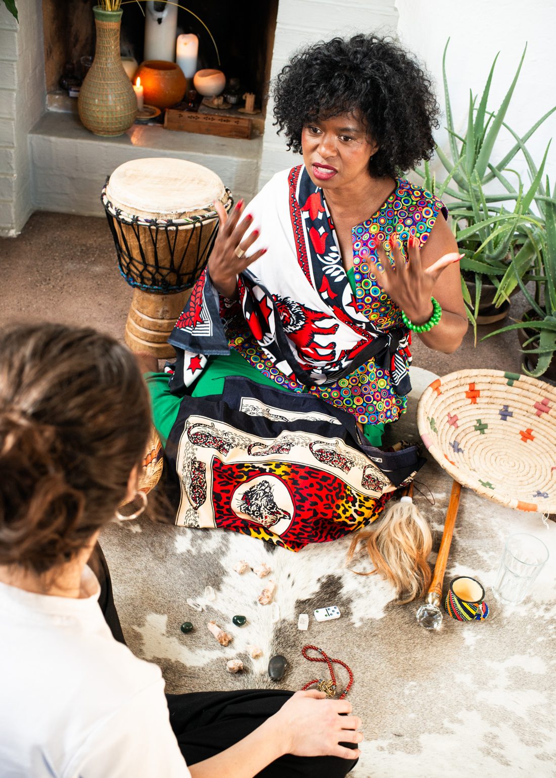 Tae Betty in a session with a client at the drum altar