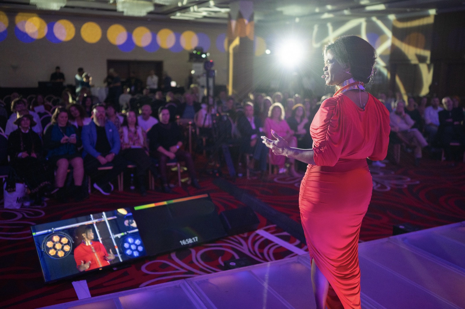 Tae Betty on stage, before an audience