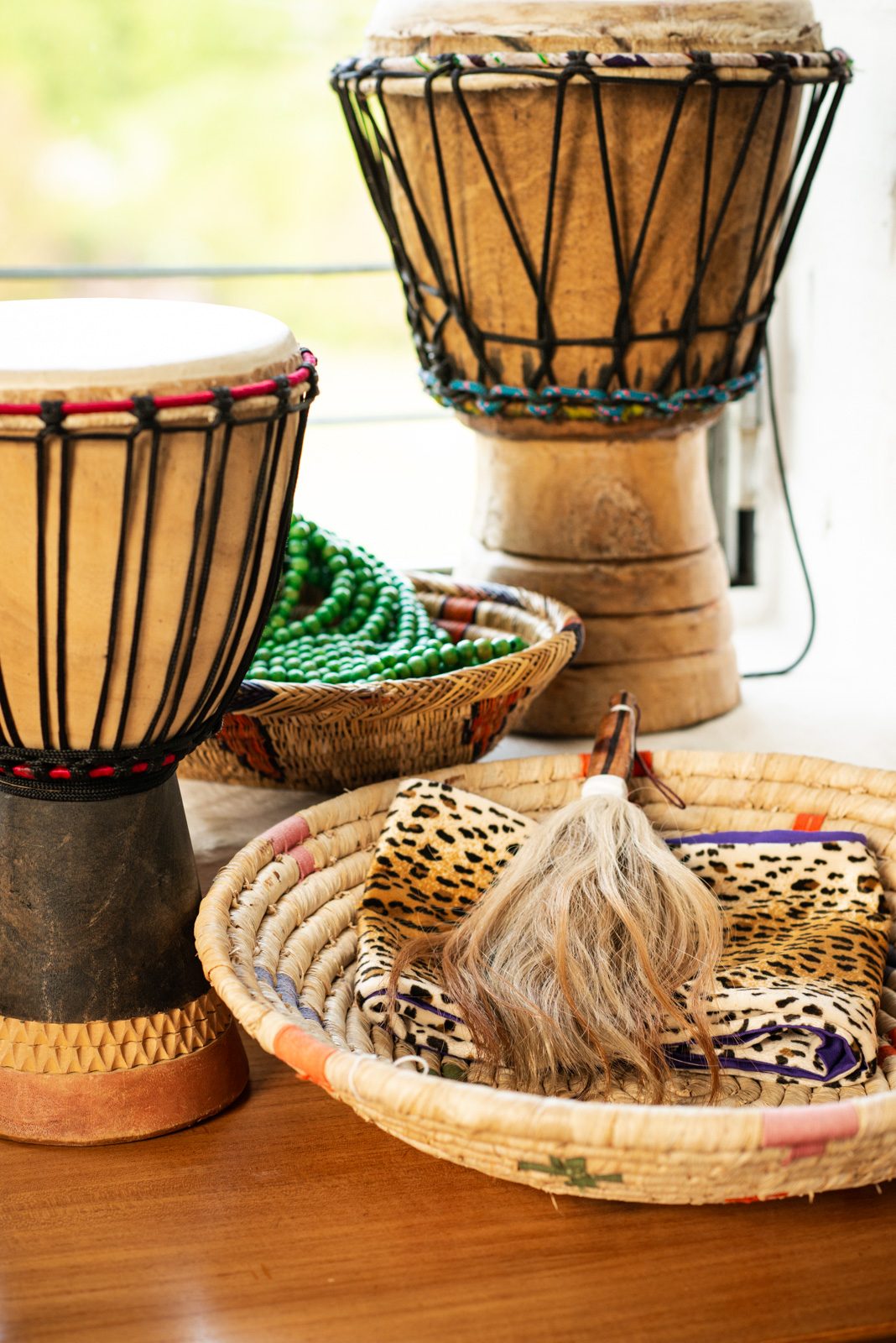 Sangoma tools and djembe drums in Tae Betty's working space